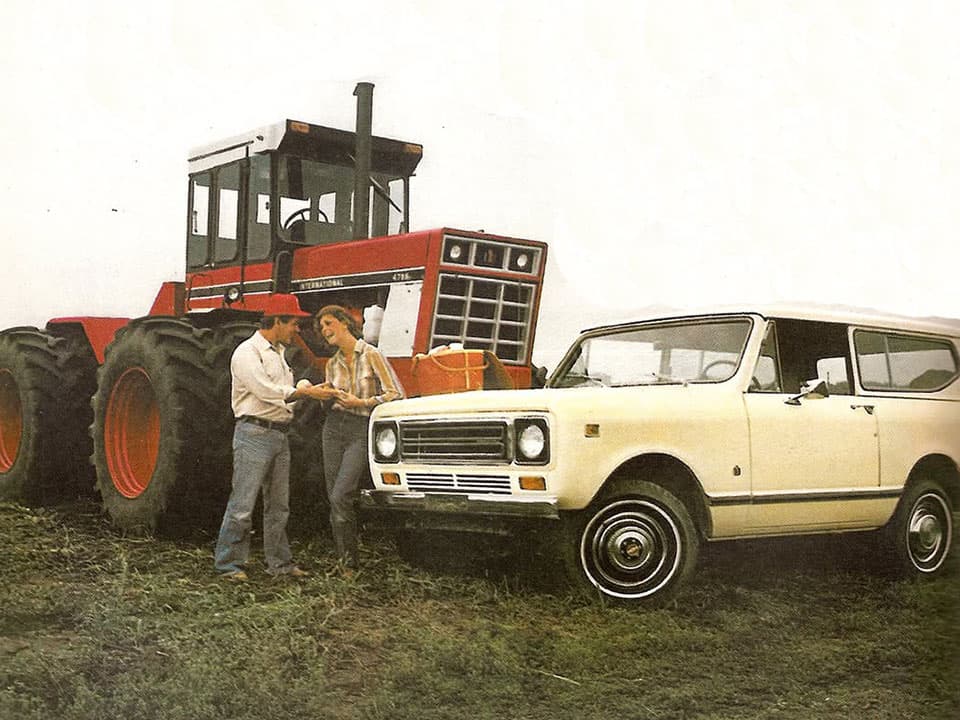 Couple with a Scout and an International tractor